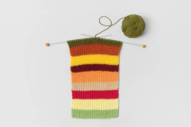 istock Green knitted wool and knitting needles 2233039211