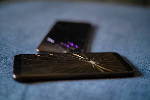 istock Old Smartphones with Shattered Glass Screen 2233040445