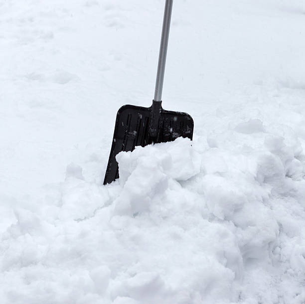 istock Snow shovel in a snowdrift. Winter time. 2233042812