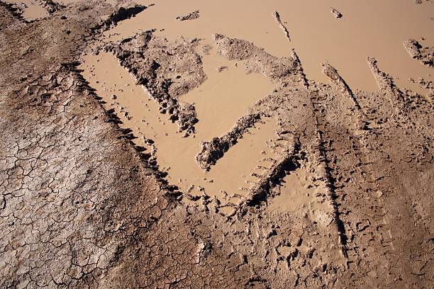 Rockanje, Netherlands -  Sunday October 24th, 2021: Off road 4x4 vehicles driving through man made sand trenches on a public beach on a sunny Sunday morning in the autumn of 2021 in Rockanje, the Netherlands