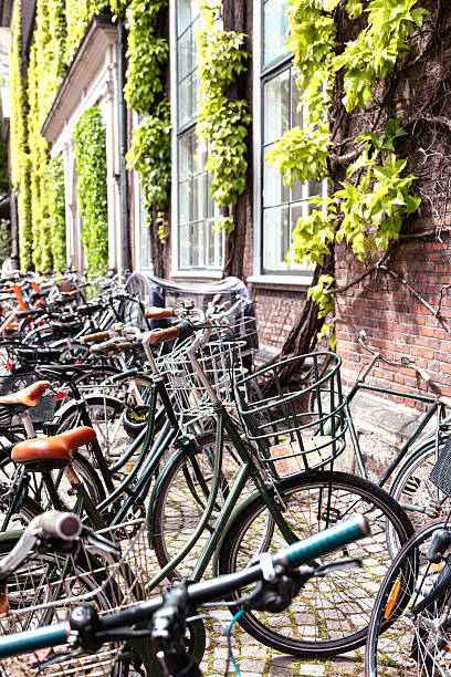 istock Bicycles against an office building - green living 2233045574