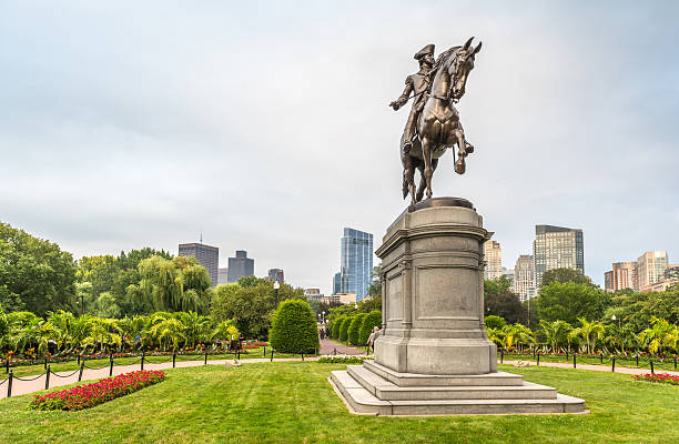 Boston, Massachusetts, USA - July 27, 2025: View of the George Washington Monument in the Boston Public Garden, Massachusetts. The sculpture was commissioned in 1859, modeled in 1864, and cast and unveiled in 1869.