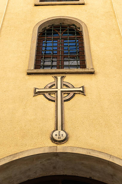 Istanbul, Turkey - September 1, 2025: Exterior view of the Virgin Mary Greek Orthodox Church located next to Narmanlı Han on Istiklal Avenue in Beyoğlu. A cross symbol and arched window are visible on the facade.