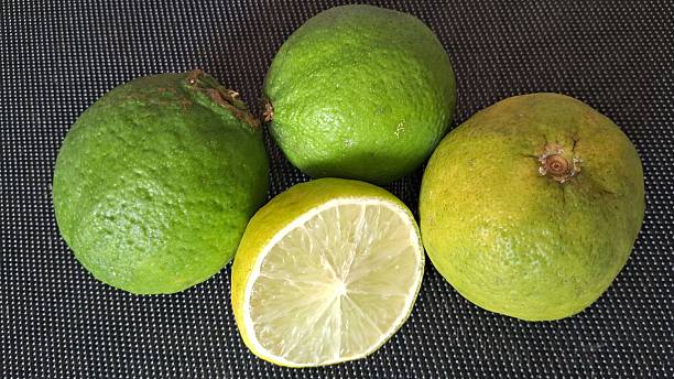 istock Fresh Limes Vibrant Citrus Fruits, One Sliced 2233055863