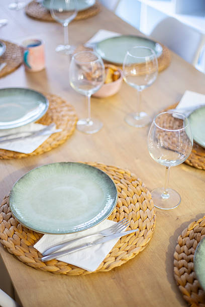 istock Beautiful cutlery and tableware on a served table on a wooden table diagonal perspective 2233057215
