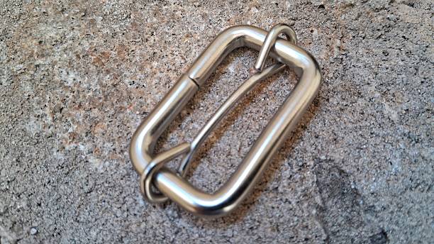 Metal rings and hooks on a concrete background