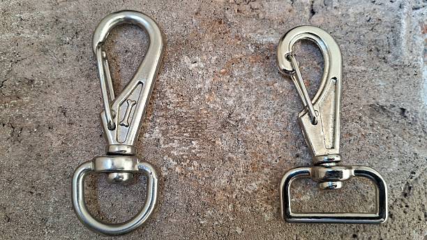 Metal rings and hooks on a concrete background