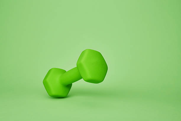 istock Green dumbbell standing upright 2233061863