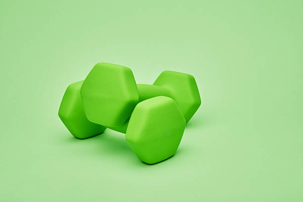 istock Pair of green dumbbells 2233061864