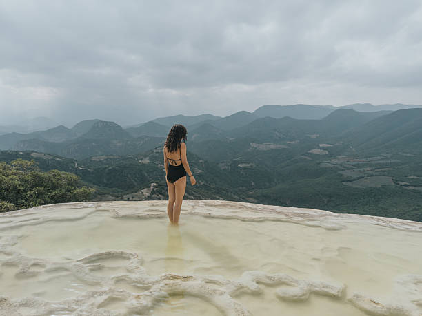 istock Woman walking on the limestone rock formations 2233062040