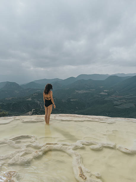 istock Woman walking on the limestone rock formations 2233062052