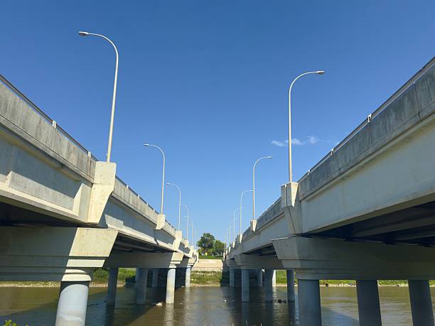 istock Concrete bridge over river on summer day 2233062109
