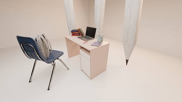 istock School desk with laptop and books beside chair with backpack 2233065064