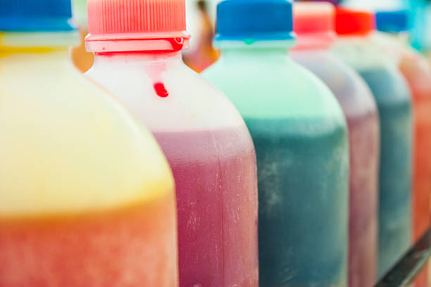 Refreshing and colorful juices displayed in plastic bottles, enticing beachgoers in Mompiche with vibrant flavors and natural ingredients, perfect for satisfying summer thirst