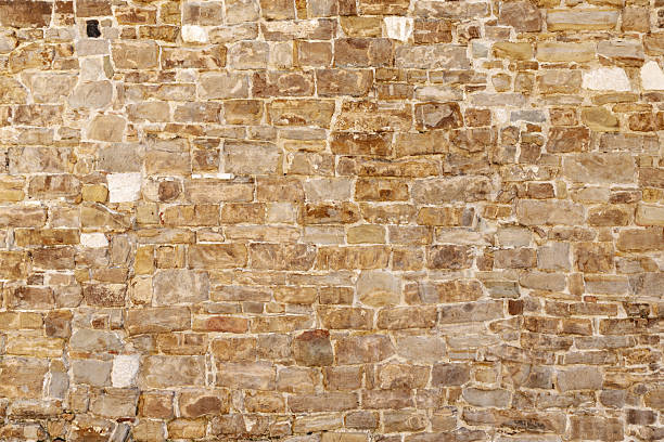 istock Old brick wall with faded colors, weathered surface, and irregular pattern, offering rustic texture for backgrounds, design, or architectural reference use 2233072170