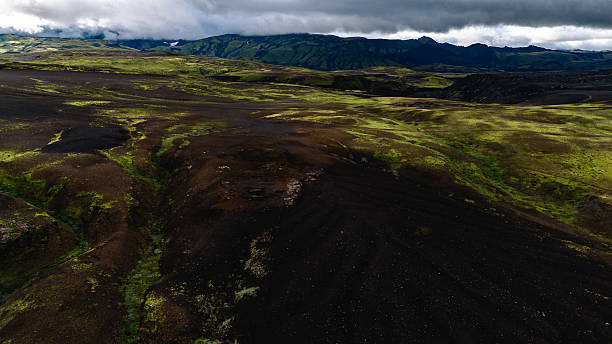 istock Green mountains and black sand 2233073277