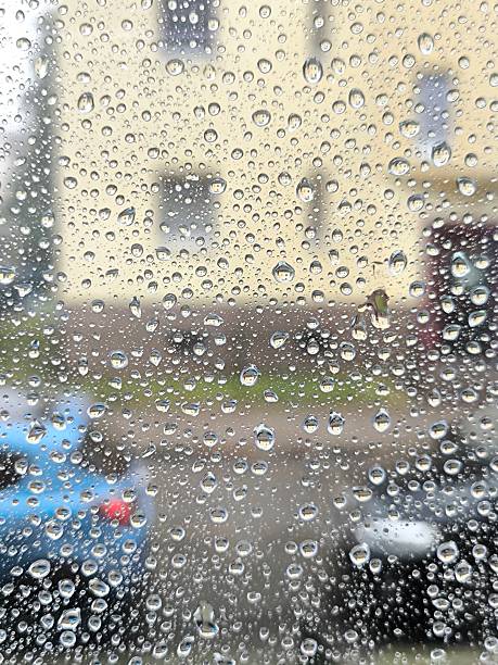 istock Rainy day outside. Raindrops on glass 2233074730