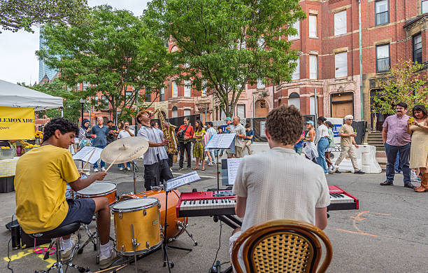 Boston, Massachusetts, USA - July 27, 2025: Music students liven up Boston's Newbury Street Festival before a large audience. This street becomes a pedestrian-only thoroughfare on summer Sundays.