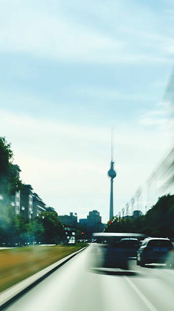 Long exposure while driving through Berlin with a view of the TV tower.