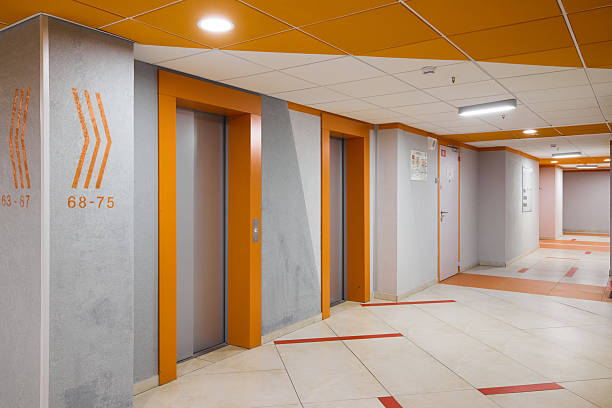 istock A modern elevator hallway with a contemporary orange and gray design, enhancing aesthetics 2233081214