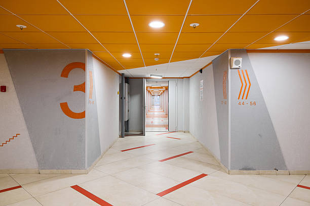 The modern corridor design features intricate geometric patterns and a variety of vibrant colors