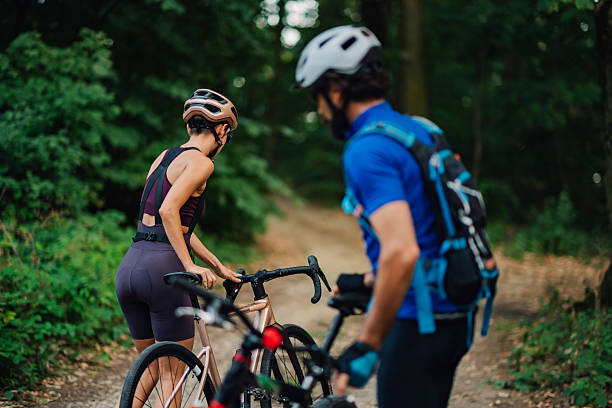 istock Cyclists taking a break on a forest trail during their mountain biking adventure 2233083238