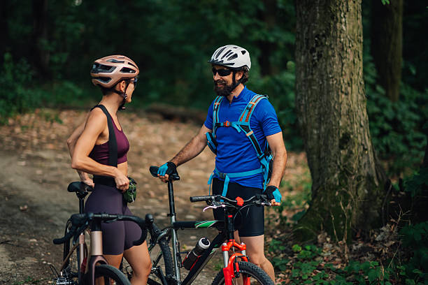 istock Cyclists taking a break and enjoying conversation in the forest 2233083243
