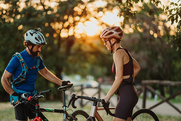 istock Cyclists taking a break at sunset during a bike ride 2233083335