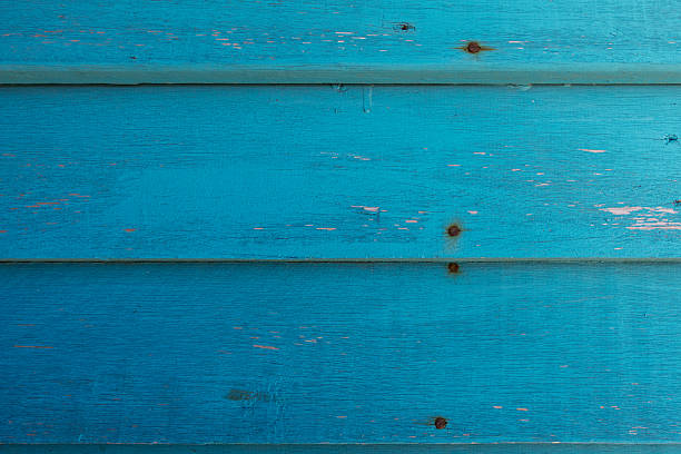 Rustic wooden slats painted turquoise.