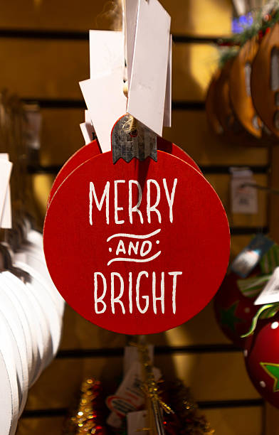 istock Red Christmas ornament with Merry and Bright text 2233086435