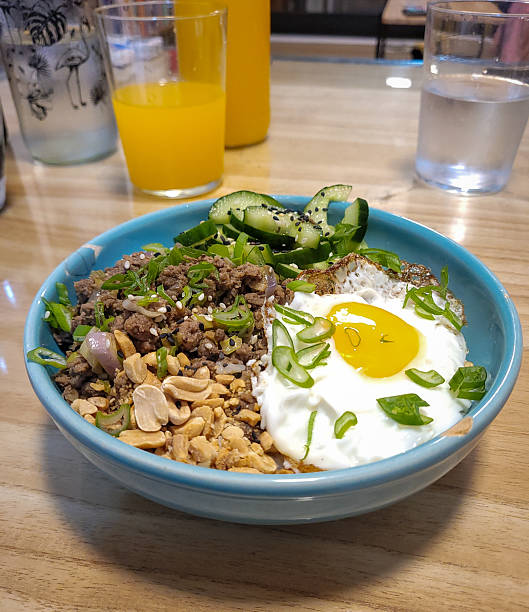 Asian Rice Bowl with Beef, Fried Egg and Vegetables