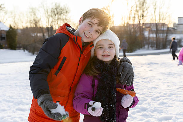 istock Winter Friends Chase Each Other Through Snow 2233087362