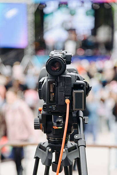 istock large black video camera on tripod outdoors 2233087759