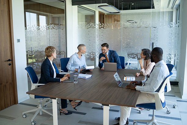 istock Business team collaborating on project in modern office meeting room 2233088029