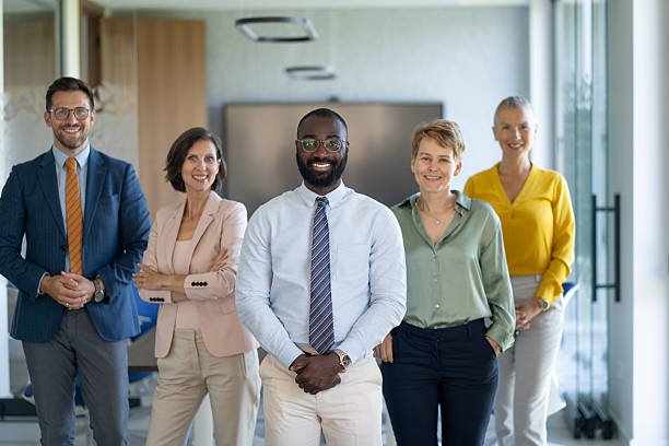 istock Confident business team smiling at camera in modern office 2233088063