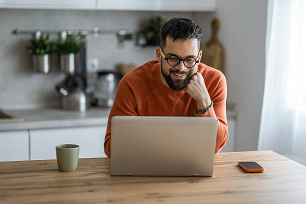 istock Young man working from home on laptop. 2233091698