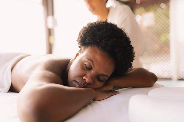 istock Black woman relaxing during spa massage 2233093218