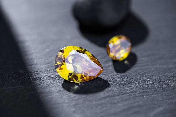 istock Yellow Gemstones on Dark Background Closeup 2233093947
