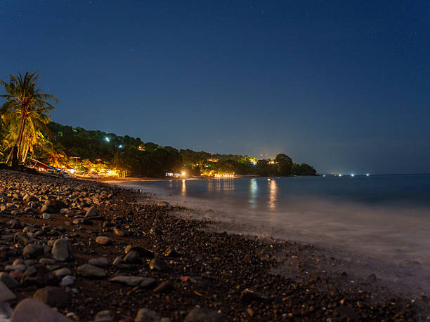 istock Night beach in Amed, Bali with illuminated coastline view 2233094797
