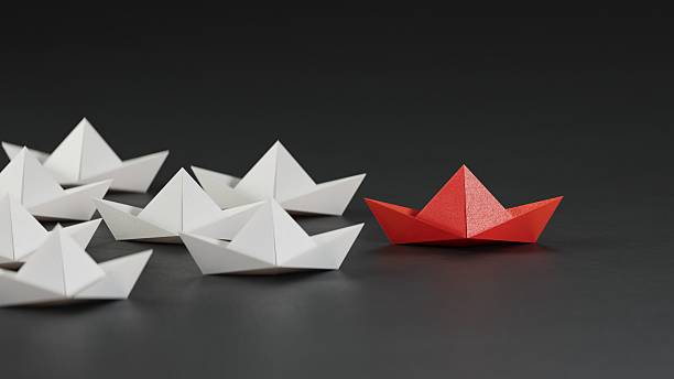 istock Different business concept.new ideas. paper art style. creative idea.Leadership concept, black leader boat leading white boats.3D rendering on black background. 2233095970