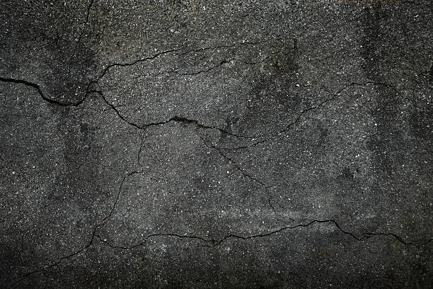 istock Crack asphalt texture background of rough  top view 2233098214