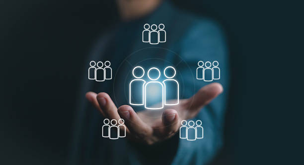 istock Hand holding digital people icons network, symbolizing human resources, teamwork, business management, leadership, collaboration, and modern organization in digital communication concept. 2233098943