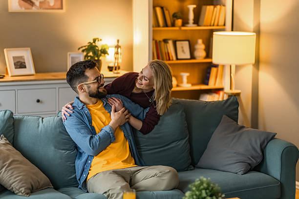 istock Happy young couple embracing at home. 2233098950