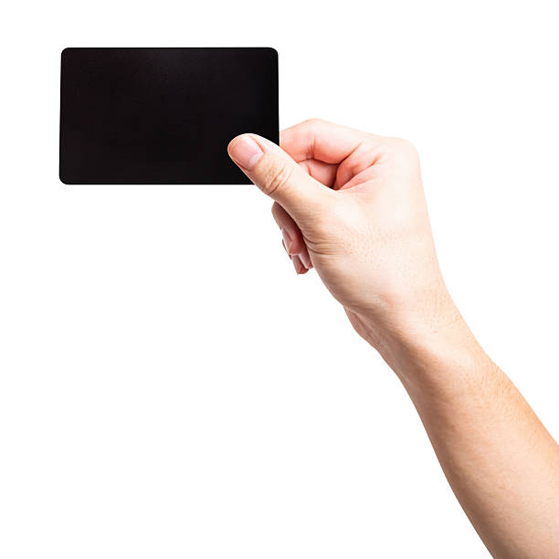 istock Man hand hold black credit card isolated on white background. 2233100953