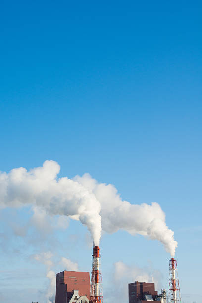 Smoke from the chimney on a background of blue sky