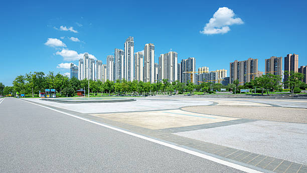 istock Empty square floor and asphalt road with modern urban skyline background 2233101197