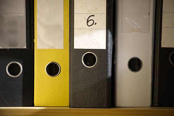 istock The image shows a close-up of several ring binder folders, neatly arranged and ready for use. 2233103655