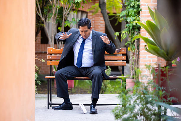 Series of a man using a cell phone and falling to the ground