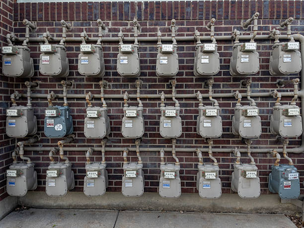 istock Gas meters measuring consumption on brick wall 2233106033
