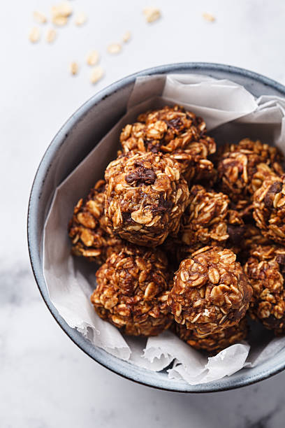 Oatmeal balls with peanut butter and chocolate chips, top view. Vegan dessert concept.
